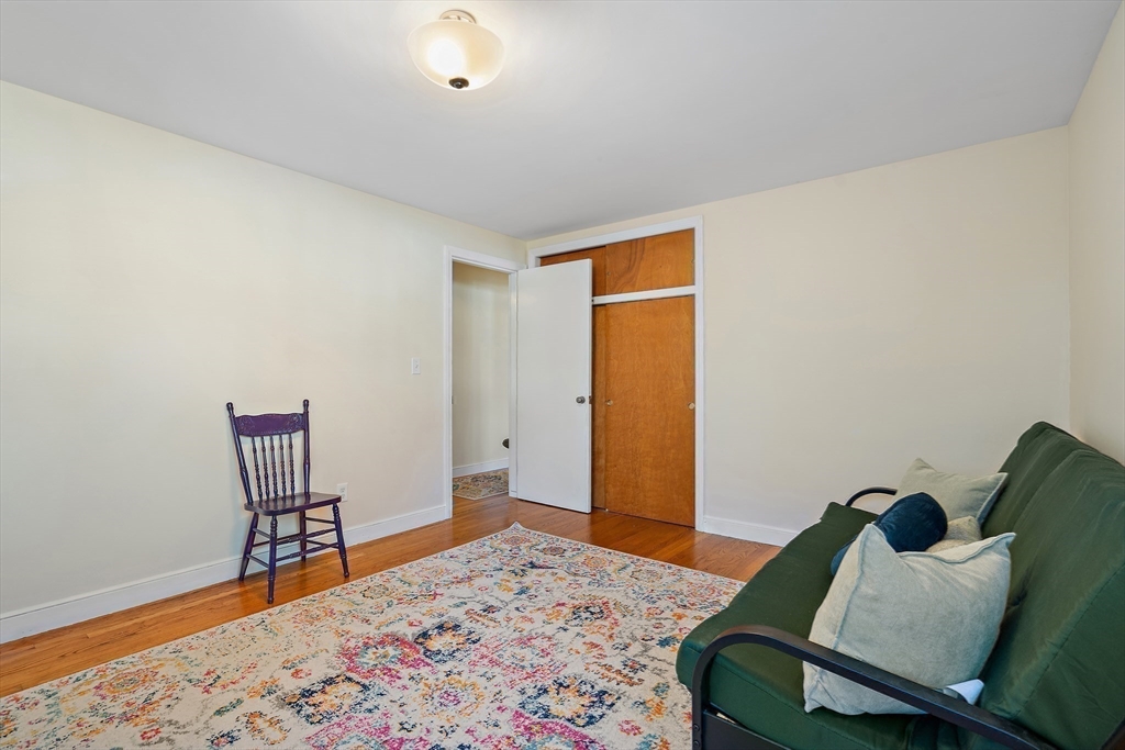 16 Beaudry Street Marlborough, MA 01752 - Photo 19 of 40 a bedroom with a bed and wooden floor