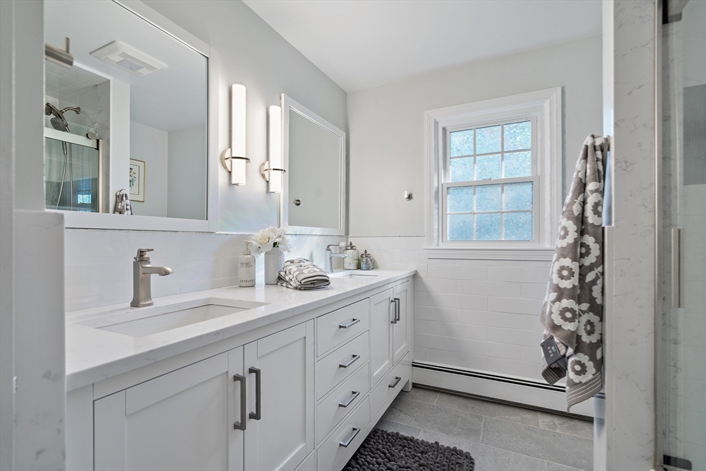 16 Beaudry Street Marlborough, MA 01752 - Photo 22 of 40 a spacious bathroom with double vanity and a mirror