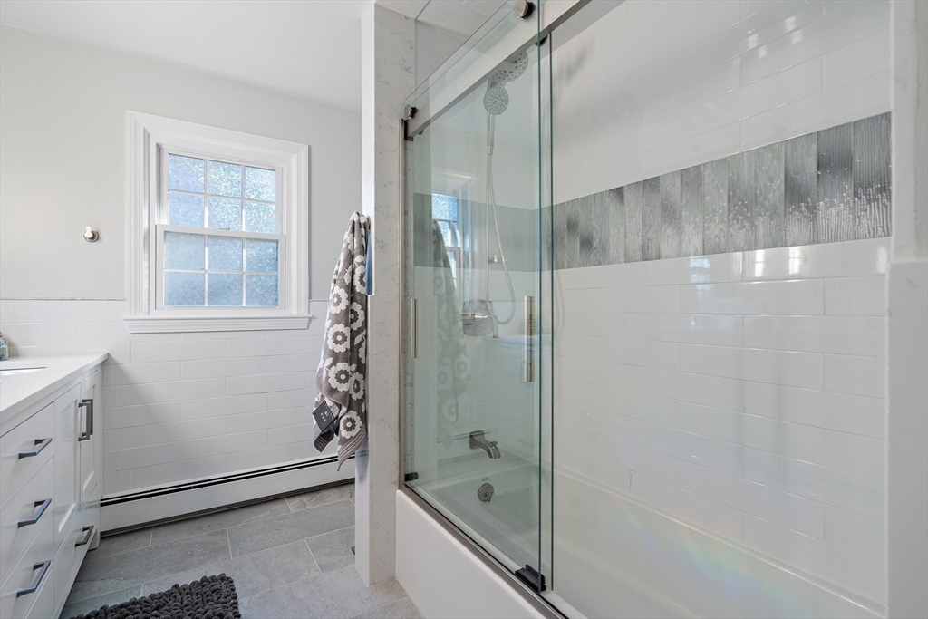 16 Beaudry Street Marlborough, MA 01752 - Photo 23 of 40 a bathroom with a bathtub and a shower