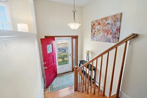 a view of entryway with stairs and a window