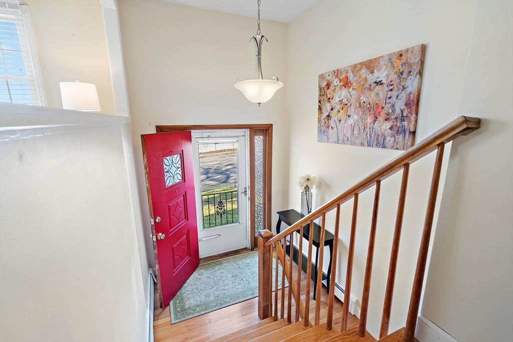 16 Beaudry Street Marlborough, MA 01752 - Photo 4 of 40 a view of entryway with stairs and a window
