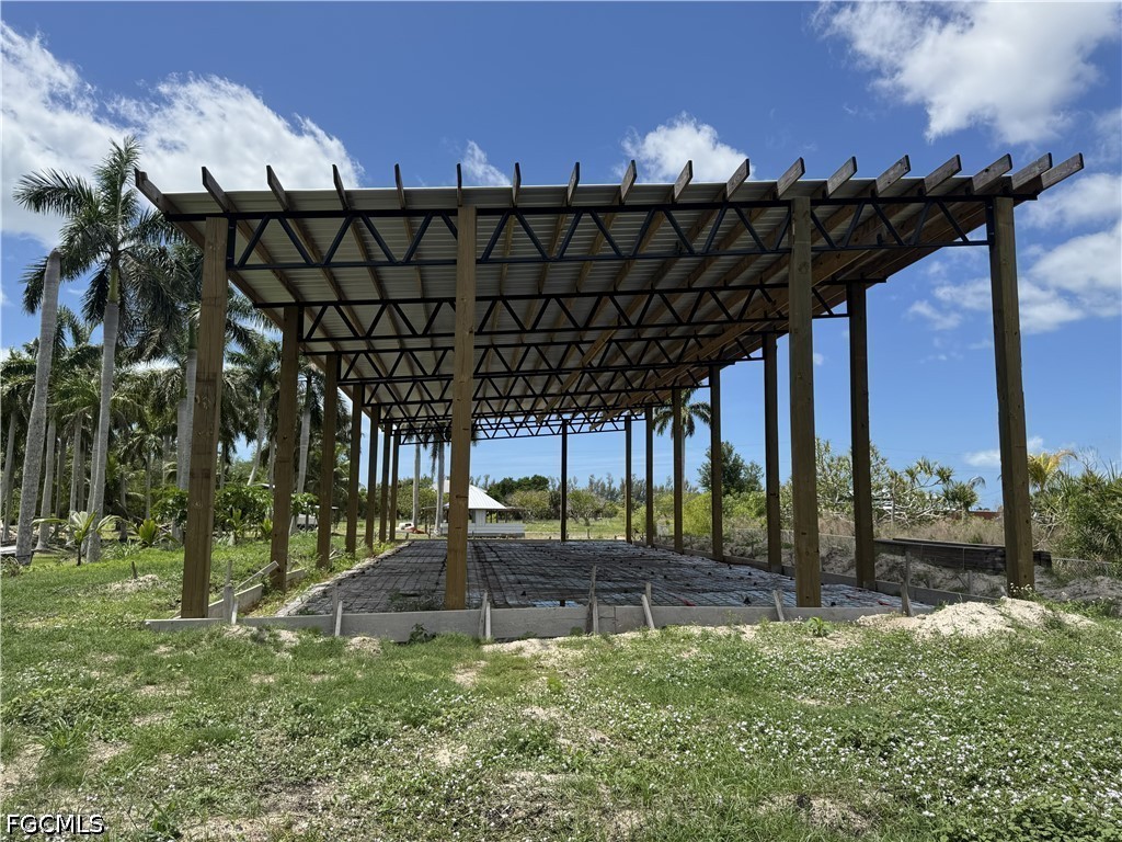 13641 Ficus Tree Lane Bokeelia, FL 33922 - Photo 20 of 33 a view of a swimming pool with a patio
