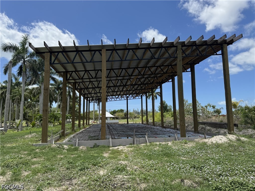 13641 Ficus Tree Lane Bokeelia, FL 33922 - Photo 21 of 33 a view of a swimming pool with a patio