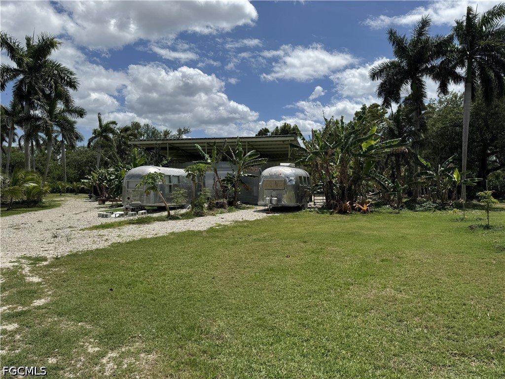 13641 Ficus Tree Lane Bokeelia, FL 33922 - Photo 31 of 33 a view of outdoor space with garden and entertaining space