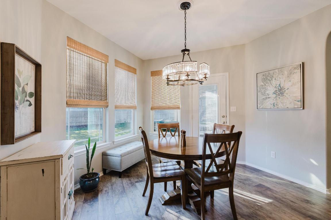 1420 Crested Butte Way Georgetown, TX 78626 - Photo 13 of 40 Dining room with dark wood-style flooring and a chandelier