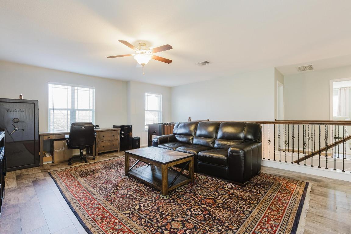 1420 Crested Butte Way Georgetown, TX 78626 - Photo 17 of 40 Flex area with an office area, ceiling fan, and light wood-type flooring (safe does not convey)