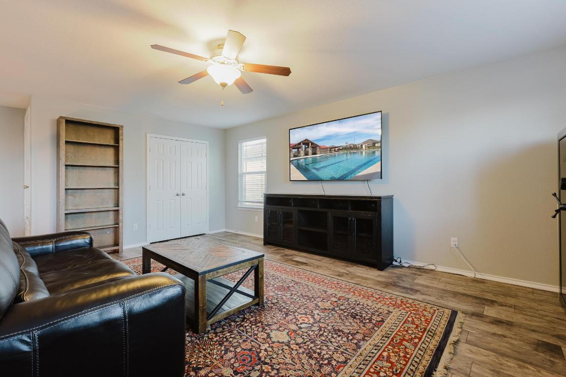 1420 Crested Butte Way Georgetown, TX 78626 - Photo 19 of 40 Flex room featuring wood finished floors, and a ceiling fan
