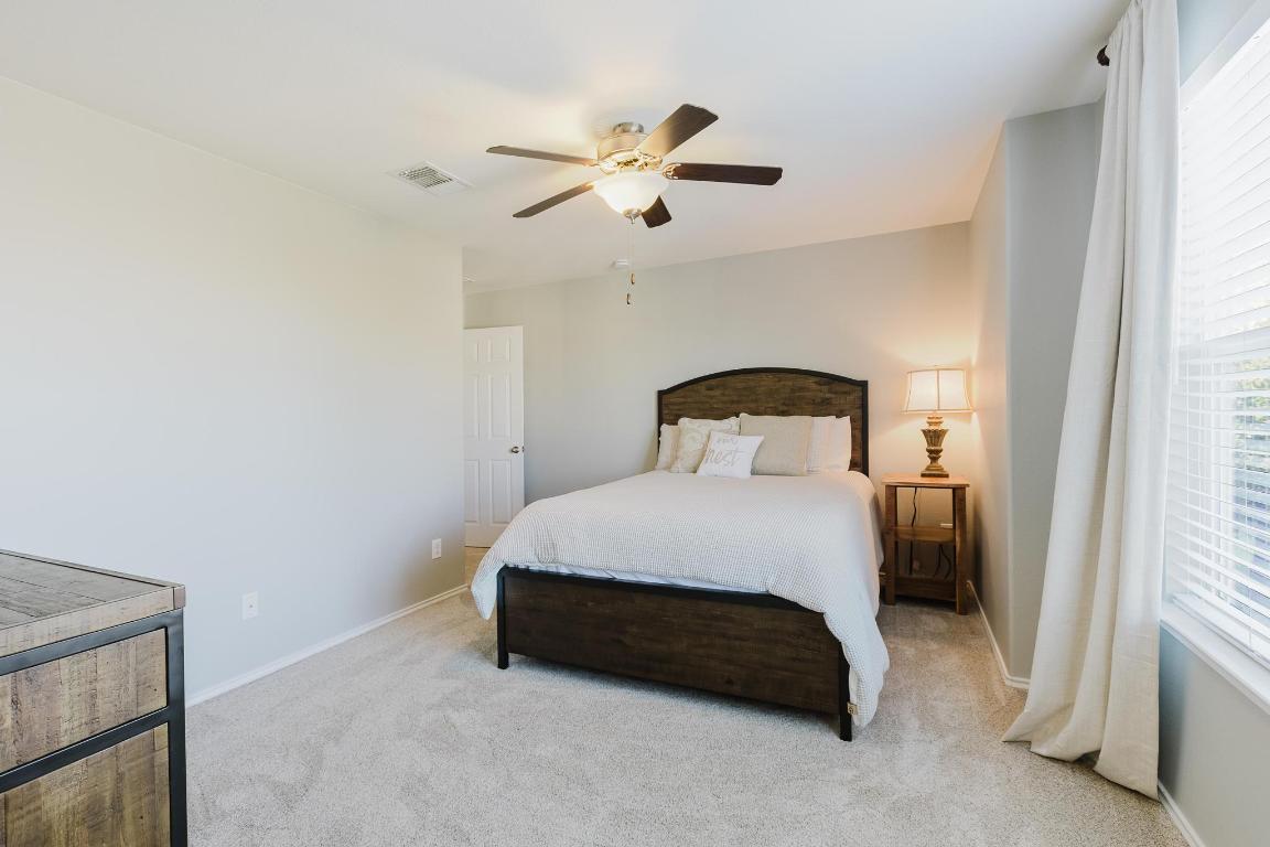 1420 Crested Butte Way Georgetown, TX 78626 - Photo 30 of 40 Bedroom 2 featuring light carpet and a ceiling fan