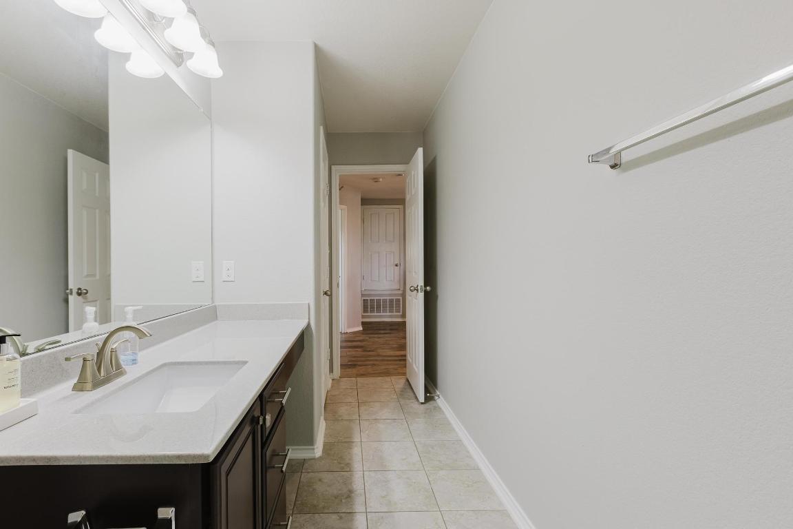 1420 Crested Butte Way Georgetown, TX 78626 - Photo 32 of 40 Upstairs Bathroom with vanity