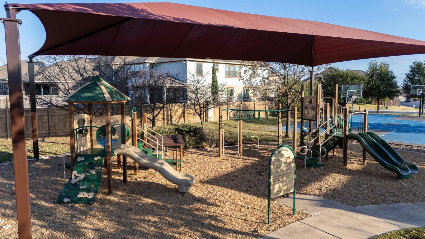 1420 Crested Butte Way Georgetown, TX 78626 - Photo 37 of 40 Communal playground featuring community basketball court