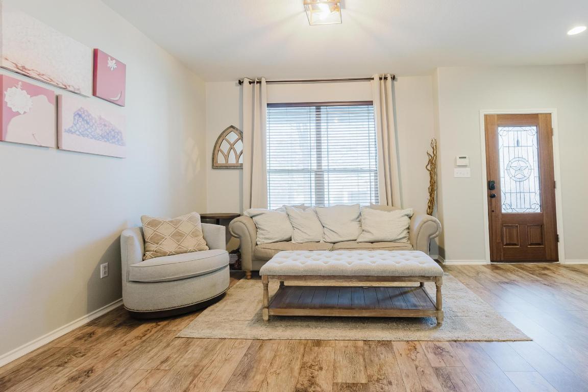 1420 Crested Butte Way Georgetown, TX 78626 - Photo 5 of 40 Formal Living area with healthy amount of natural light and wood finished floors