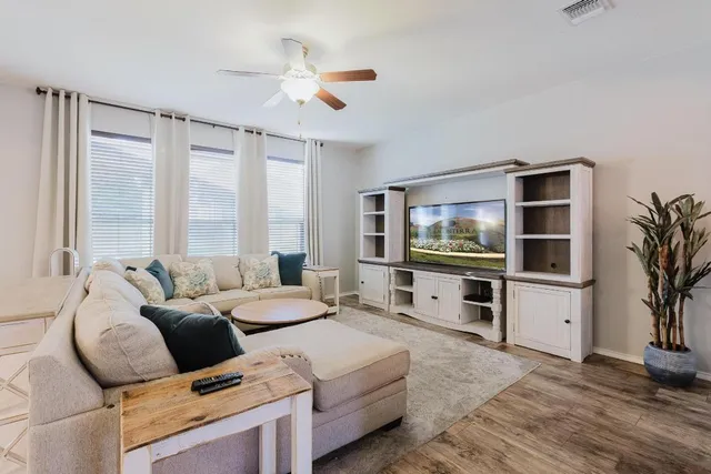 a living room with furniture and a large window