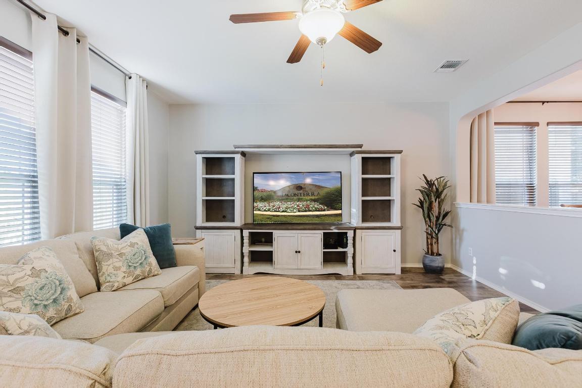 1420 Crested Butte Way Georgetown, TX 78626 - Photo 9 of 40 Living room with a ceiling fan and wood finished floors