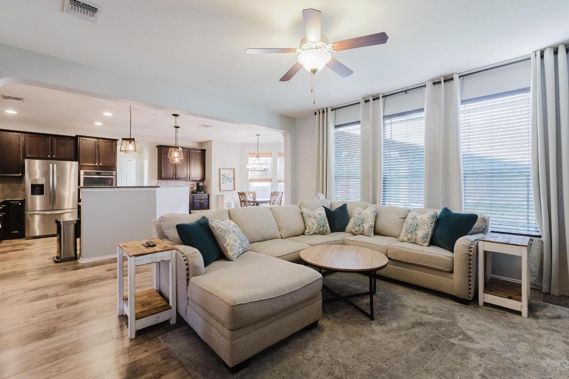 1420 Crested Butte Way Georgetown, TX 78626 - Photo 10 of 40 Living area with ceiling fan, light wood finished floors, and recessed lighting