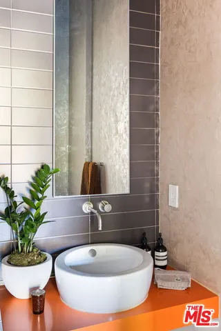 a bathroom with a tub and a sink
