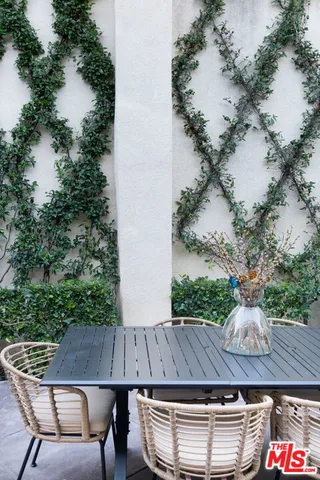 an aerial view of residential house with outdoor seating