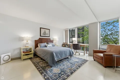 a bed room with a bed and a couch