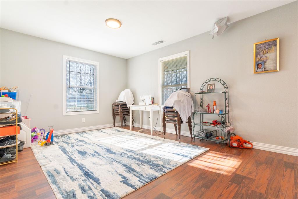 4732 Springer Street Dallas, TX 75216 - Photo 11 of 11 a bedroom with a bed closet and a window
