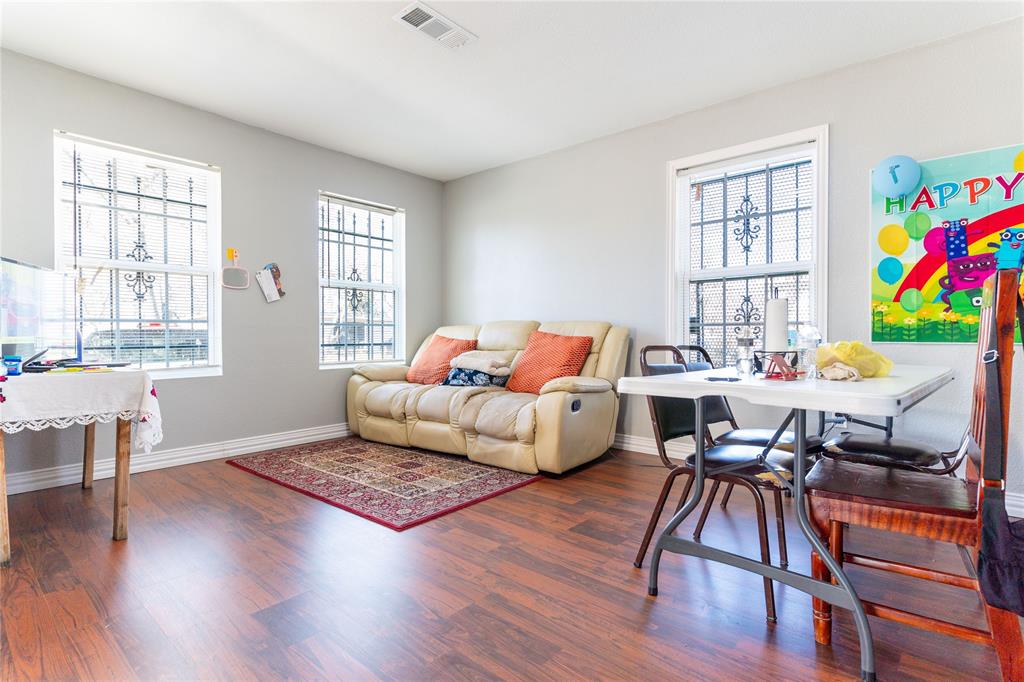 4732 Springer Street Dallas, TX 75216 - Photo 9 of 11 a living room with furniture and a wooden floor