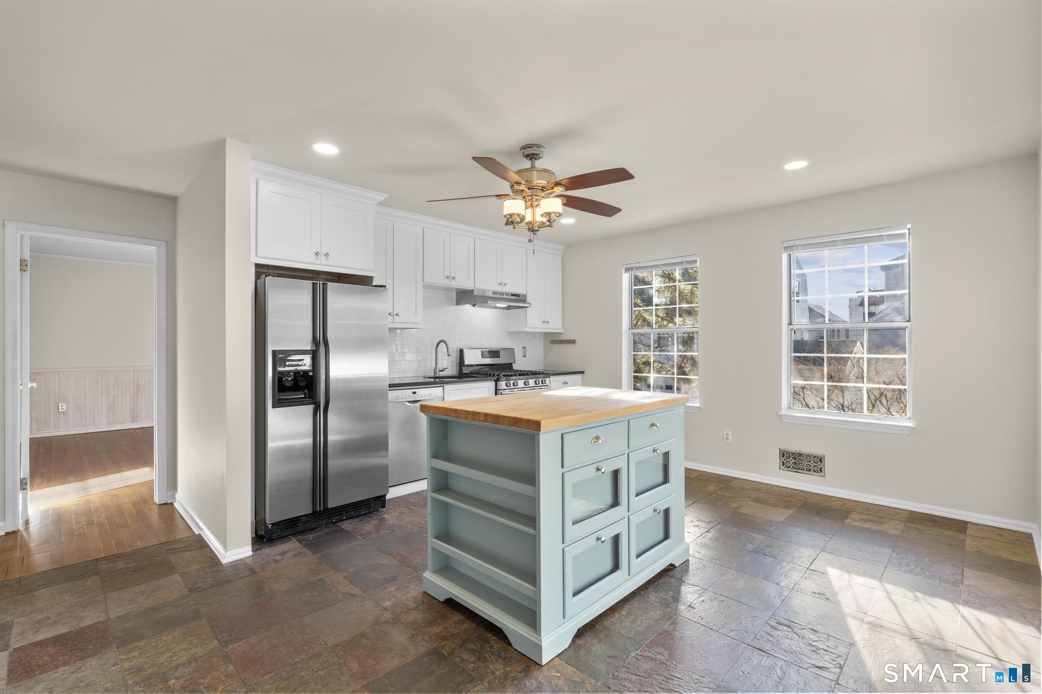 254 Seaside Avenue, Unit A Stamford, CT 06902 - Photo 12 of 28 a kitchen that has a lot of cabinets in it