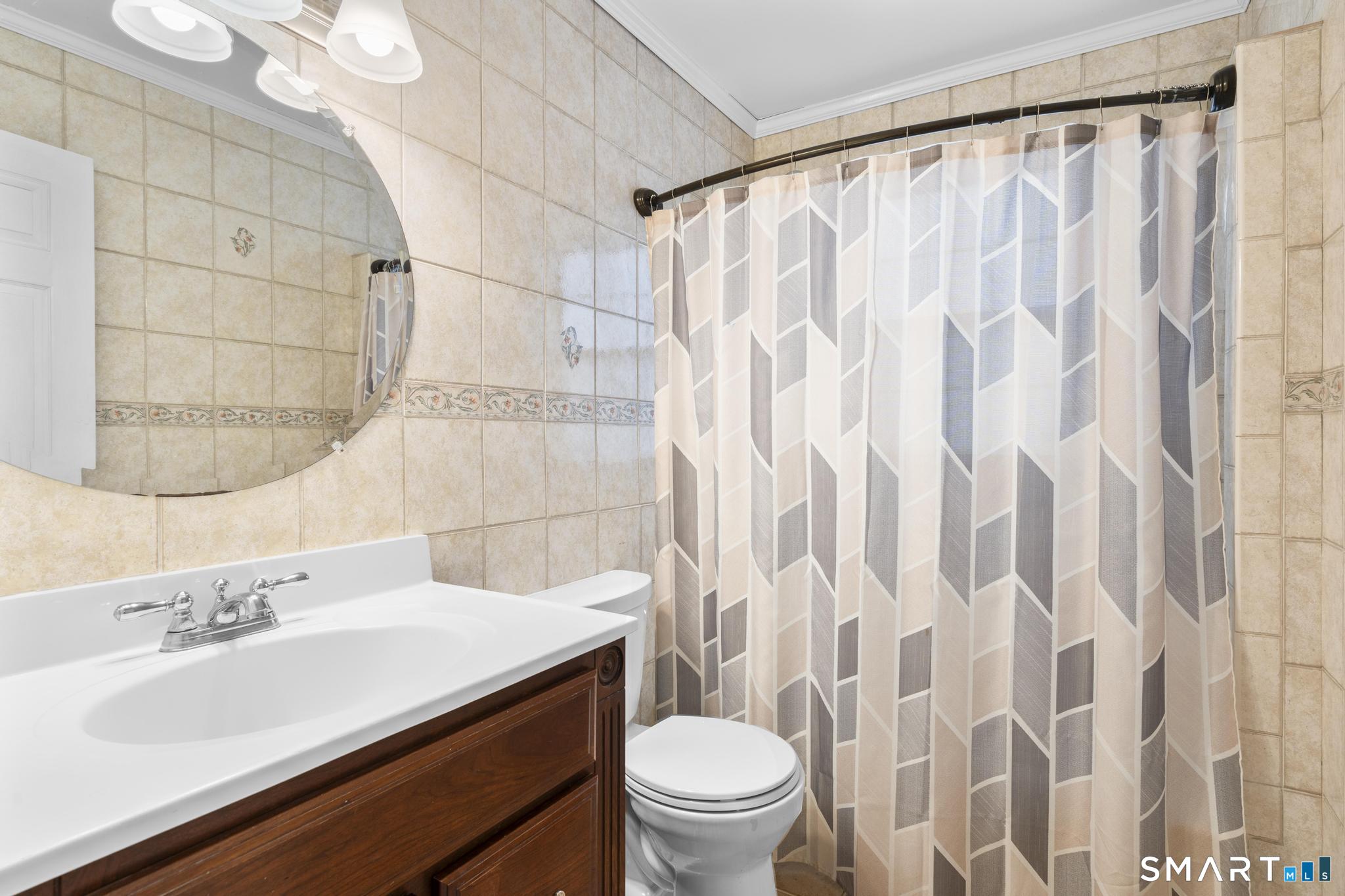 254 Seaside Avenue, Unit A Stamford, CT 06902 - Photo 20 of 28 a bathroom with a sink toilet and shower