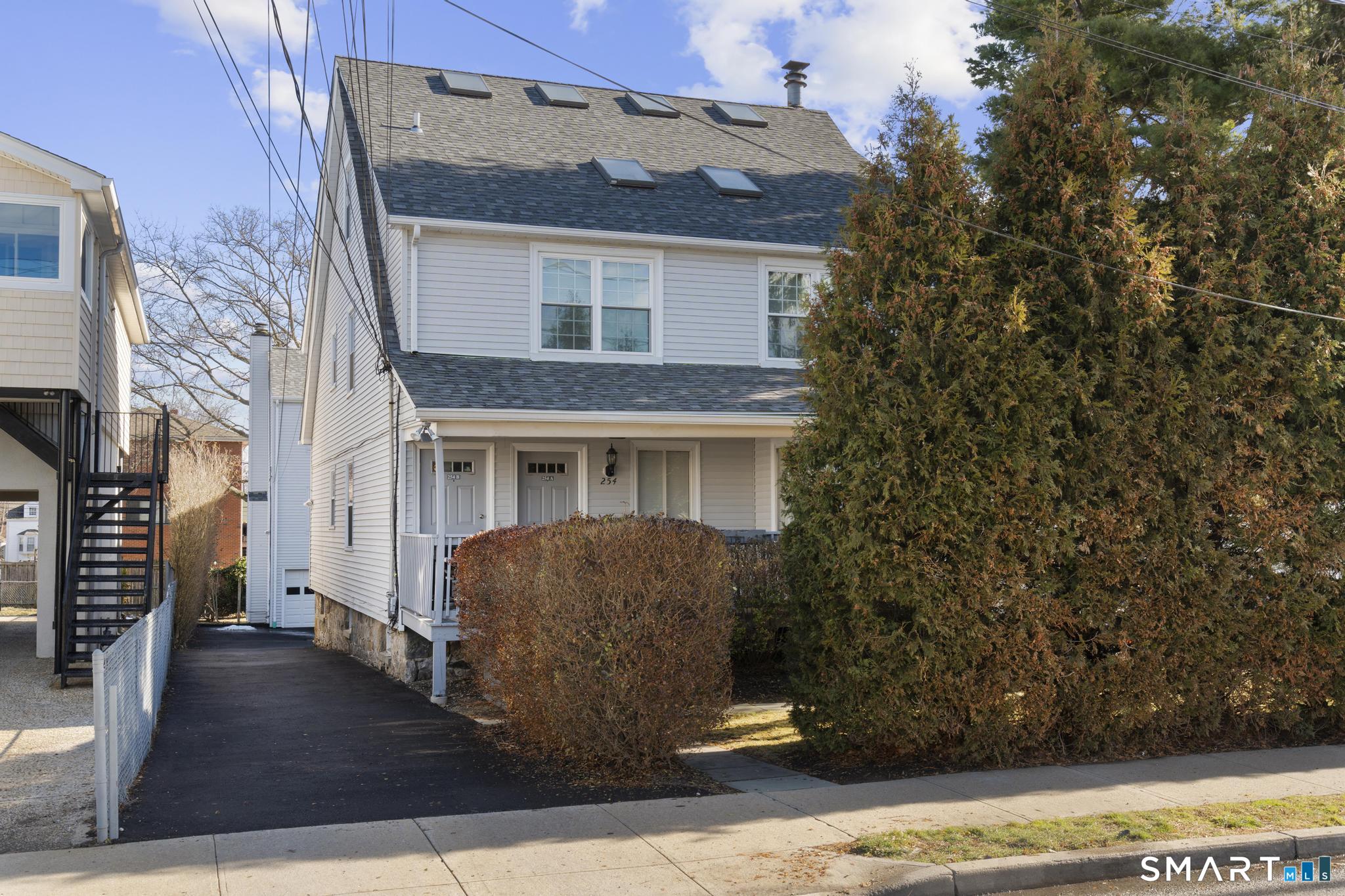 254 Seaside Avenue, Unit A Stamford, CT 06902 - Photo 2 of 28 a front view of a house with a yard