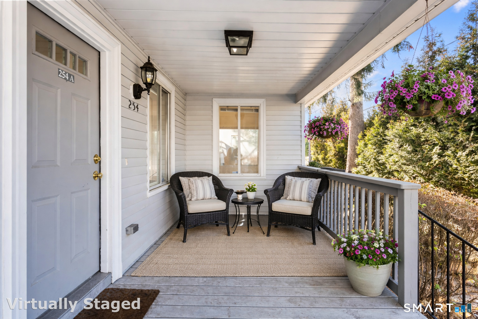254 Seaside Avenue, Unit A Stamford, CT 06902 - Photo 4 of 28 a view of a porch with furniture and a potted plant