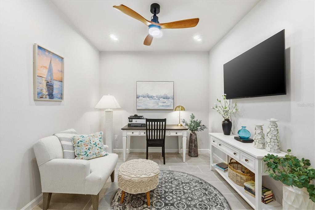 12333 Asana Court Venice, FL 34293 - Photo 15 of 58 a living room with furniture and a flat screen tv