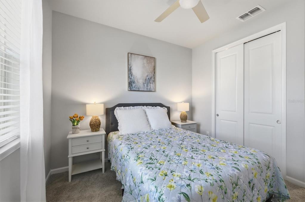 12333 Asana Court Venice, FL 34293 - Photo 22 of 58 a bedroom with a bed and a window