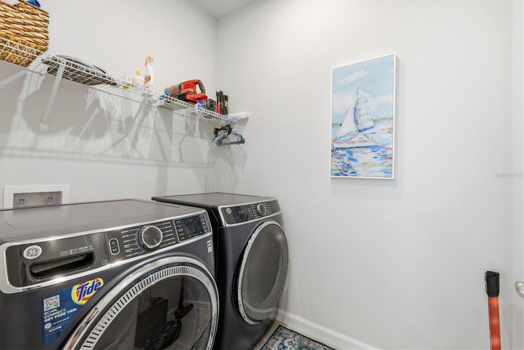 12333 Asana Court Venice, FL 34293 - Photo 27 of 58 a utility room with dryer and washer