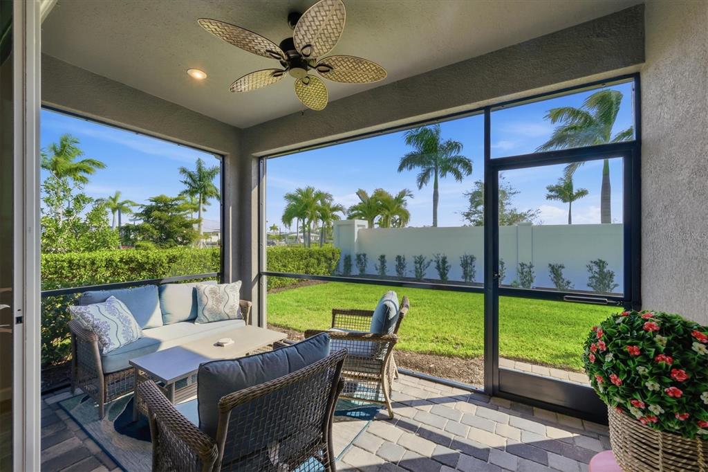 12333 Asana Court Venice, FL 34293 - Photo 28 of 58 a outdoor dining space with furniture and garden view