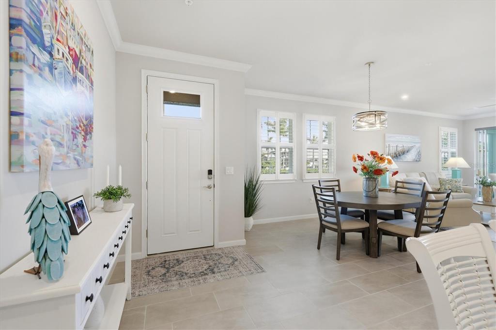 12333 Asana Court Venice, FL 34293 - Photo 3 of 58 a view of a dining room with furniture and chandelier