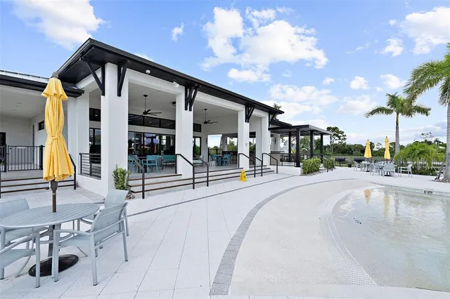 a view of a dining room with furniture wooden floor and chandelier