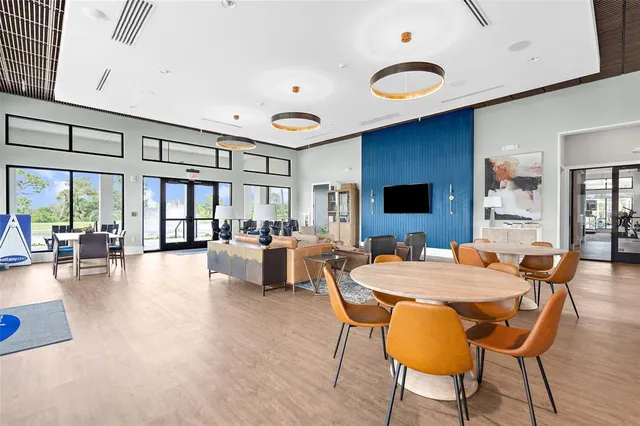 a view of a living room and kitchen with a large window