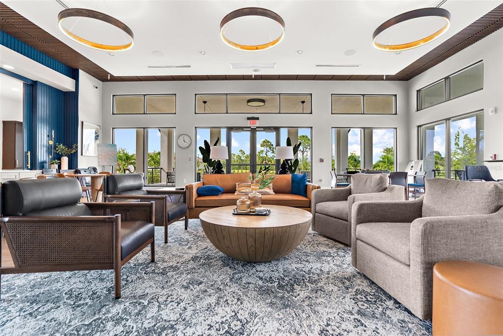 12333 Asana Court Venice, FL 34293 - Photo 37 of 58 a living room with furniture a rug and a large window