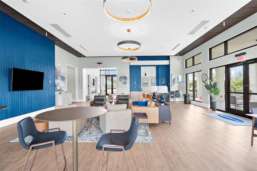 12333 Asana Court Venice, FL 34293 - Photo 38 of 58 a view of a dining room with furniture wooden floor and chandelier