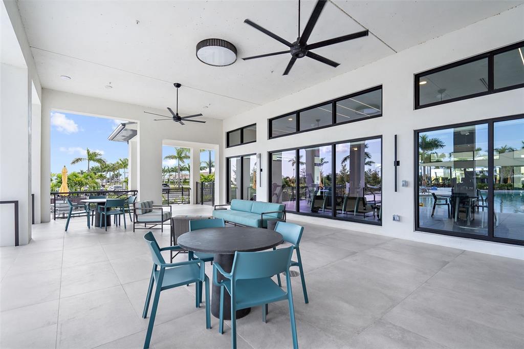 12333 Asana Court Venice, FL 34293 - Photo 39 of 58 a dining area with furniture and a large window