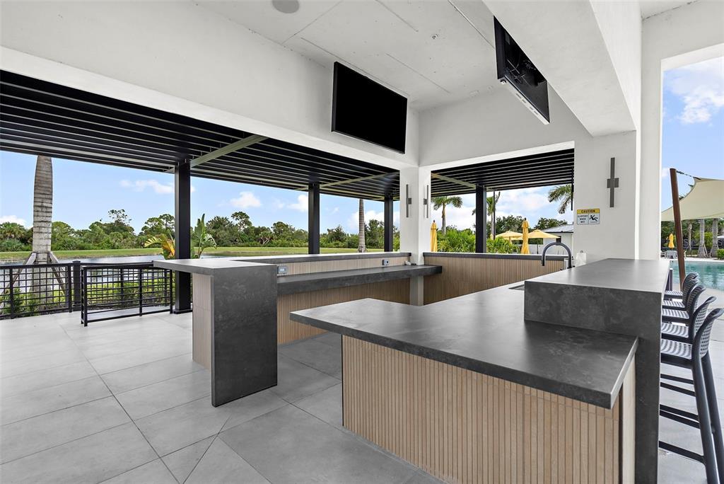 12333 Asana Court Venice, FL 34293 - Photo 41 of 58 a view of a living room and kitchen with a large window