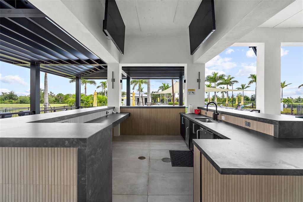 12333 Asana Court Venice, FL 34293 - Photo 42 of 58 a kitchen with a large window and a counter top space