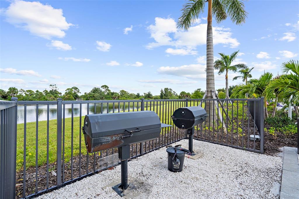 12333 Asana Court Venice, FL 34293 - Photo 50 of 58 a view of a lake and a yard