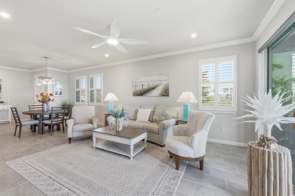 12333 Asana Court Venice, FL 34293 - Photo 6 of 58 a living room with furniture and a large window