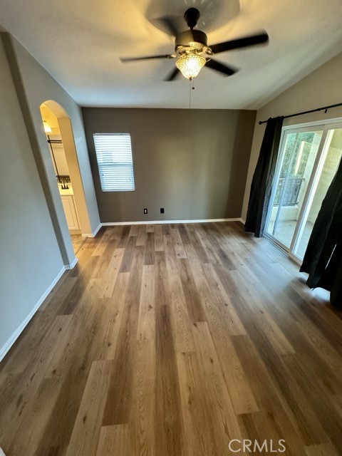 41685 Woodridge Avenue, Unit 2 Murrieta, CA 92562 - Photo 12 of 22 wooden floor in an empty room with a window