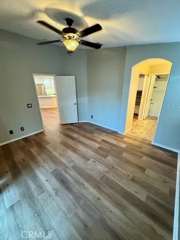 a view of a room with wooden floor