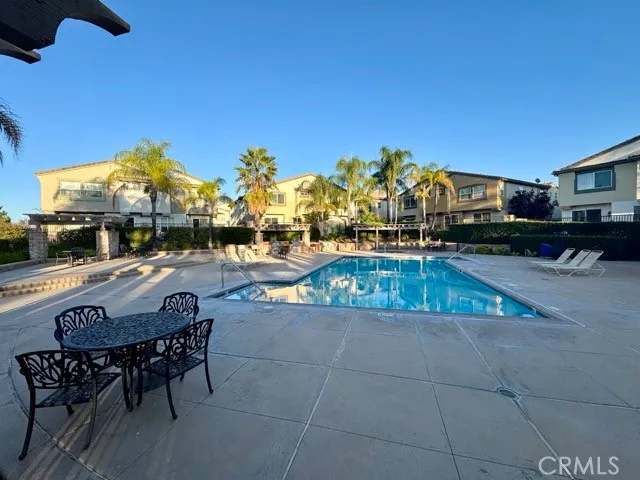 a view of a swimming pool with a patio