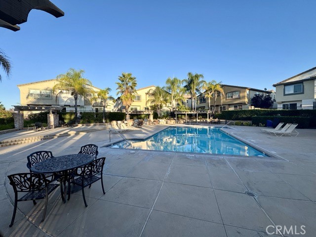 41685 Woodridge Avenue, Unit 2 Murrieta, CA 92562 - Photo 19 of 22 a view of a swimming pool with a patio