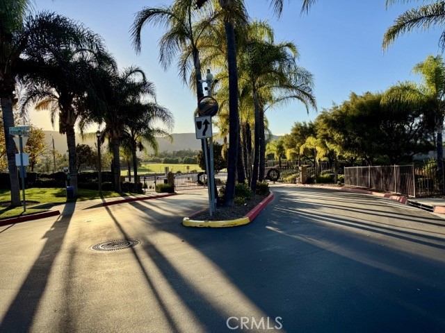 41685 Woodridge Avenue, Unit 2 Murrieta, CA 92562 - Photo 20 of 22 a view of a swimming pool with a table and chairs