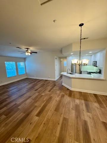 a view of a kitchen with furniture and window