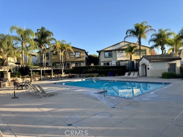 41685 Woodridge Avenue, Unit 2 Murrieta, CA 92562 - Photo 21 of 22 a front view of a building with street view