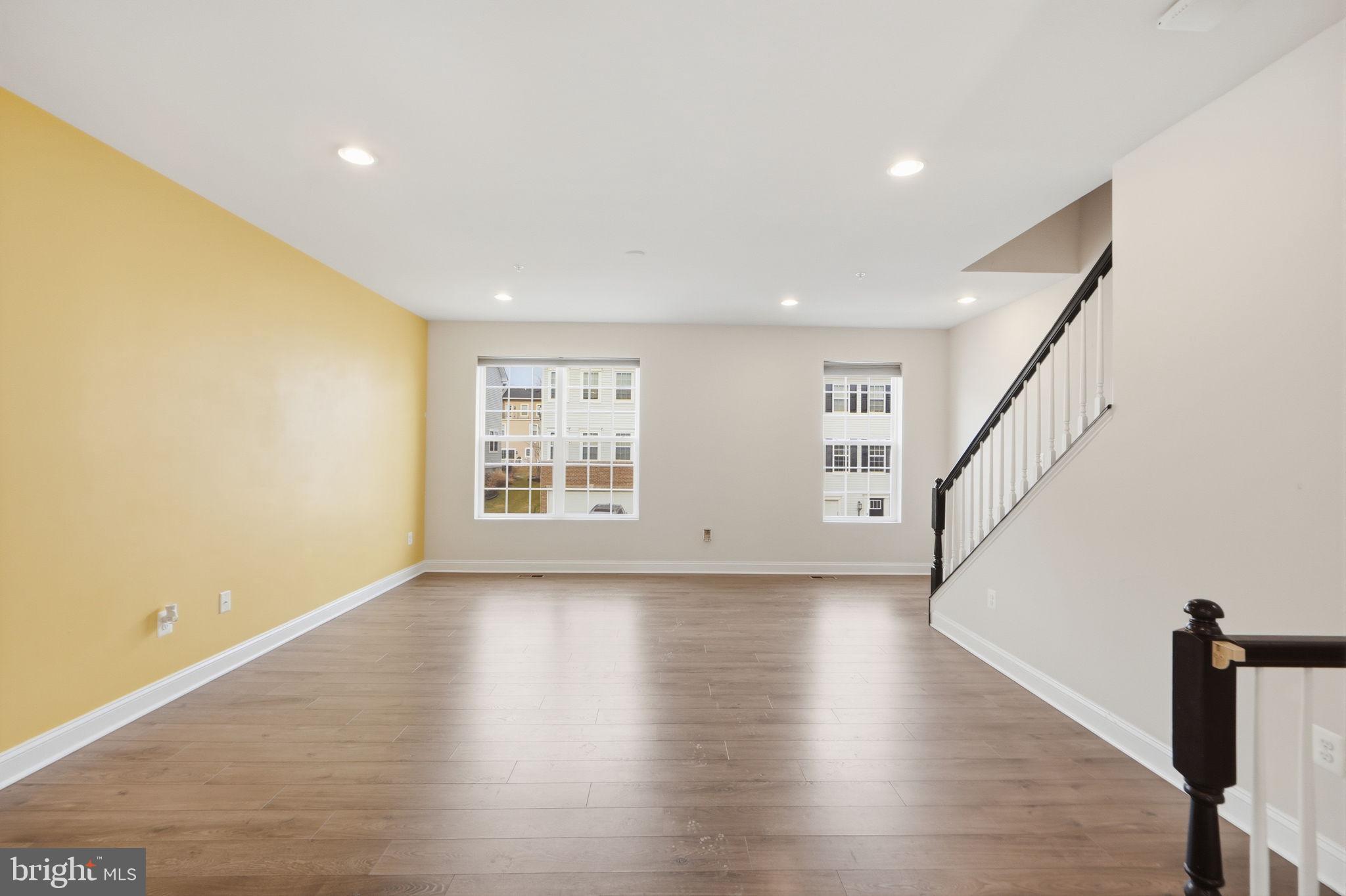 3623 Duckhorn Way Laurel, MD 20724 - Photo 12 of 48 a view of an empty room with wooden floor and stairs