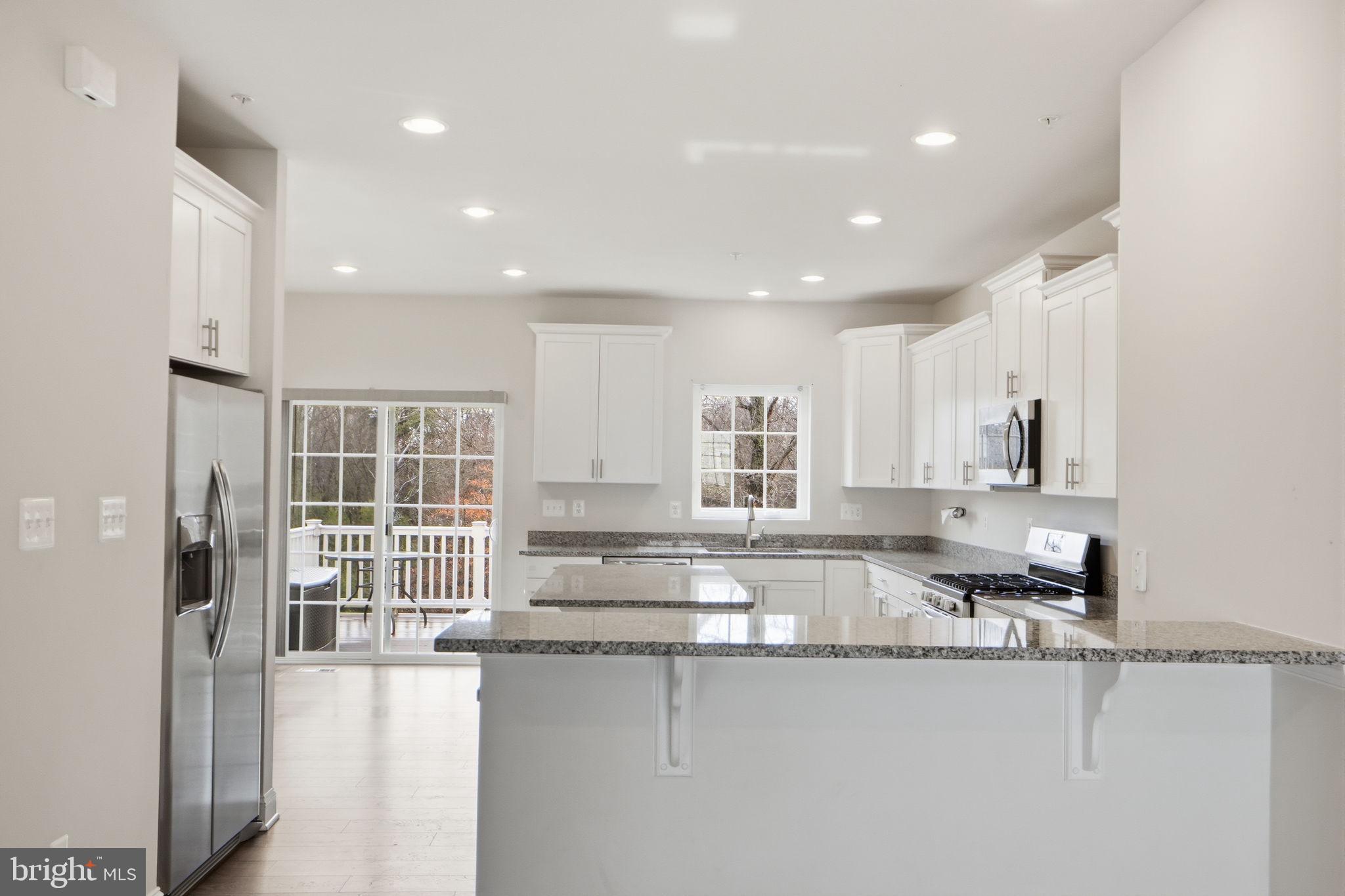 3623 Duckhorn Way Laurel, MD 20724 - Photo 17 of 48 a kitchen with stainless steel appliances granite countertop a sink and cabinets